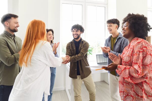 group of people welcoming the new hire