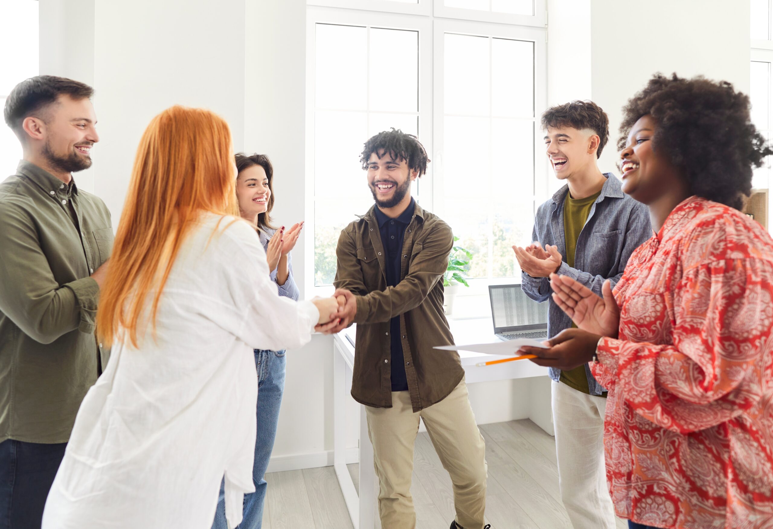 group of people welcoming the new hire
