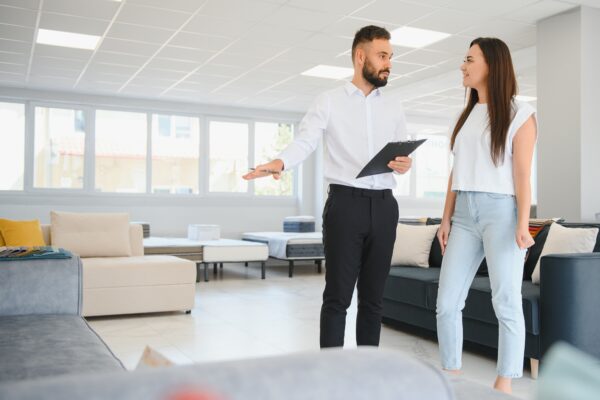 A sales rep explaining a product to a female customer