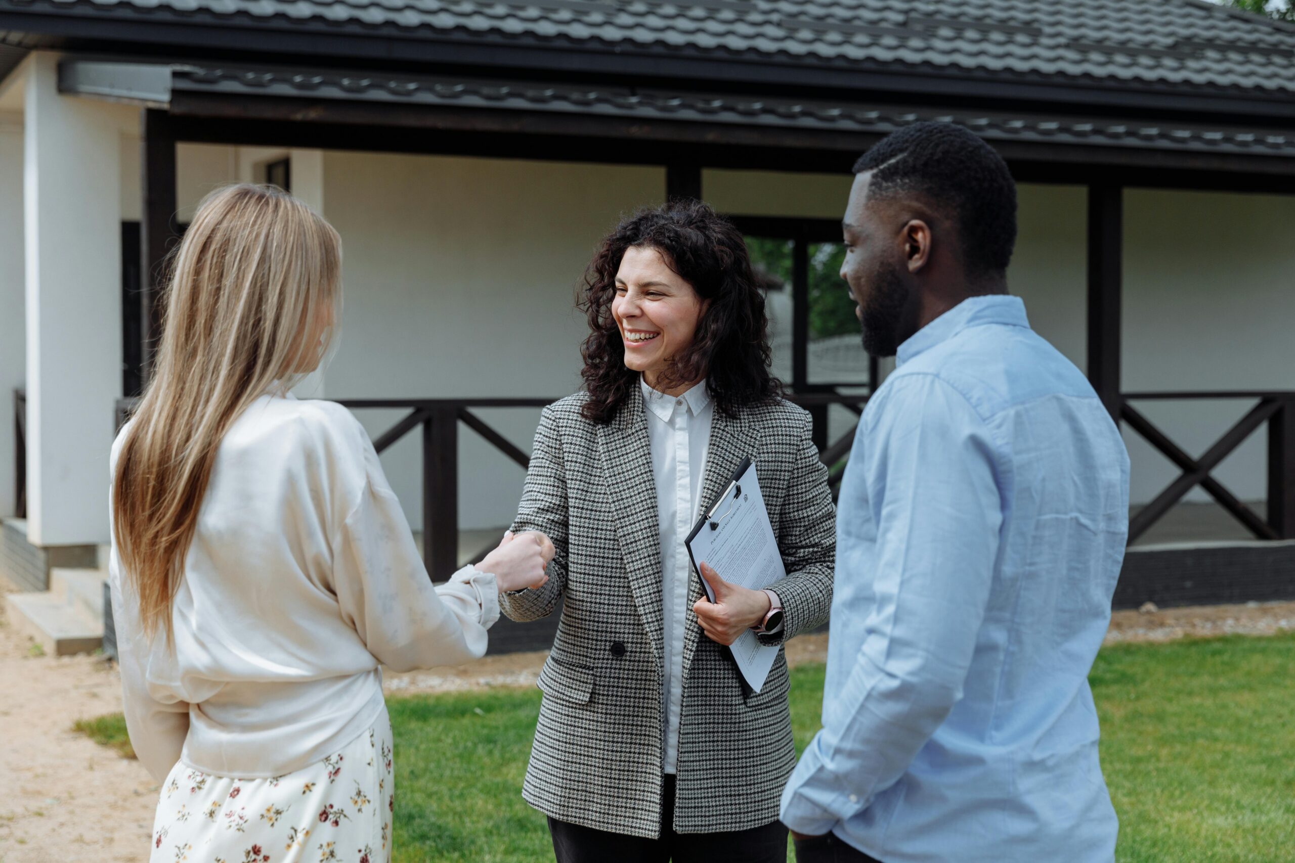 Two women shaking hands in a professional setting, symbolizing direct sales.